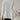 Elegant hooded cardigan for women displayed on a mannequin, showcasing its chic winter fashion design with a focus on outerwear elements like the hood and shoulder detailing, in a clean white color.