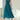 Elegant teal midi dress with a sleeveless fit and flare design, perfect for formal events, displayed on a mannequin near a window.