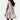 Elegant white ruffle hem mini dress with short sleeves, perfect for summer casual wear, modeled by a woman showcasing the dress's fitted waist and flowing knee-length skirt.