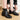 Elegant women's black leather ankle boots showcasing a chic winter style, featuring a sleek design and high-quality material, perfect for fashionable cold-weather outfits.