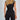 Elegant women's black sleeveless belted jumpsuit designed in a chic and formal sheath style, featuring a fitted waist and tailored one-piece silhouette that enhances the neck and thigh areas.