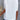 Elegant women's casual chic white blouse with draped back and loose fit, featuring a stylish neckline and relaxed sleeves.