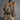 Elegant women's soft fur oversized sweater in a plush grey fabric, featuring a cozy design that highlights the shoulder and neck areas with long sleeves, perfect for winter fashion.