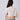 Elegant women's white floral lace crop top with short sleeves and a fitted waist, showcasing intricate lace detailing and a stylish summer design.