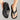 Ergonomic black flip flops featuring arch support, lightweight design, and durable synthetic rubber material.