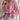 Floral Boho Blouse in Pink Paisley with Tassel Neck and Long Sleeves, showcasing a relaxed fit with intricate patterns and purple accents.