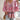 Floral boho blouse in pink paisley design featuring a tassel neck and long sleeves; styled on a mannequin highlighting the shoulder, neck, and sleeve details.