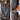 Floral Boho Chic women's blouse featuring long sleeves and a mandarin collar, paired with jeans. The blouse is white with intricate floral patterns, highlighting a fashionable and elegant design.