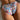 Trendy women's summer swimwear featuring floral high-cut bikini bottoms in pink, highlighting waist and thigh with petal-like patterns.