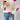 Vibrant floral knit sweater for women, featuring a cozy autumn/winter design with colorful patterns, long sleeves, and a comfortable neckline.