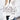 A chic and trendy women's white fluffy sweater featuring a v-neck and floral pattern, styled with jeans, highlighting a fashionable and stylish look.