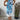 Woman wearing a floral print sleeveless summer tunic top with blue accents, standing confidently.