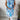 Floral print sleeveless summer tunic top for women, featuring a blue and white floral design, shown on a mannequin with visible shoulder and neck details.