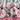 Floral print women's jacket featuring decorative zipper, with a pink and white flower pattern on the textile and long sleeves.