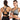 Woman wearing a front-zip high support cross-back sports bra, showcasing the design and fit of the bra with visible shoulder and muscle definition.