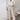 Stylish geometric high waist beige trousers for women, showcasing a fashionable statement look.