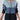 Gradient blue women's zip-front ribbed knit ombre sweater displayed on a white background, featuring long sleeves and a high neckline.