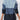 Gradient blue women's zip-front ribbed knit ombre sweater displayed on a mannequin, showcasing the shoulder and neck detailing. The sweater features a stylish gradient ombre effect transitioning from darker to lighter shades, highlighting its fashionable design.
