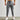 Gray men's tapered joggers, lightweight athletic sweatpants showing the waist, thigh, knee, and leg areas.