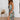 Green floral wrap midi dress with a v-neck and sleeveless design, showcasing a stylish and elegant spring fashion look.