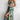 Green floral wrap midi dress with a V-neck and sleeveless design, perfect for spring fashion, featuring a fitted waist and flowing skirt.