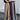 Woman wearing high-waist beige palazzo trousers, styled for casual streetwear.