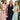 Ivory backless crossover strap bridesmaid maxi dress with pockets worn by a smiling woman, featuring a flowing one-piece garment with elegant shoulder details and a defined waist, suitable for bridal parties.