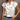 White V-neck sleeveless women's summer blouse with a leaf print design.