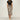 Leopard print high-waist midi skirt worn by a woman, showcasing a trendy and fashionable design. The skirt features a bold leopard pattern, extending to knee length, paired with a stylish top and footwear.