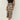 Leopard print high-waist midi skirt with a trendy design, styled with a fashionable one-piece garment for women.