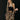 Leopard print women's suit featuring a chic skirt and matching jacket, showcasing fashion design elements with attention to sleeve, waist, and chest detailing.