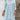 Light blue bohemian crochet V-neck lace dress featuring a delicate lace pattern, designed as a women's beach cover-up. The dress highlights the shoulders and waist with its flowing sleeves and intricate textile details.