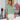 Light blue V-neck split sleeve button-front blouse for women. Elegant top with a stylish design, showcasing shoulder details and fashionable appearance.