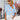 Light blue V-neck split sleeve button-front blouse with elegant design for women, modeled by a woman wearing sunglasses, highlighting shoulder detail.