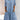 Light blue women's denim shirt dress featuring lace trim and pockets, with long sleeves and a collared neckline.