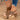 Light grey suede platform clog sandals with studded high heels, featuring a wooden sole, worn on a woman's foot.