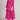 Women's pink linen loungewear set featuring a tunic with sleeves and matching pants, designed for maternity wear. The tunic has a collar and falls to the knee, ideal for summer comfort.