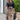 A woman is wearing a stylish outfit suitable for the office, featuring a long paisley skirt paired with a black blouse.