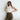 Elegant two-tone luxury designer tote bag for women, showcased being carried on a shoulder, highlighting its fashionable design and sophisticated style.