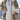 Luxury women's winter coat made from multi-tone faux fur in shades of white and grey, featuring a stylish collar, long sleeves, and tailored waist design.