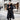 Luxury women's designer down jacket with fur hood, featuring a parka coat style. The jacket has a sleek overcoat design with long sleeves and a fitted waist. It includes a distinctive collar and reaches down to thigh or knee length, offering a stylish and sophisticated look.