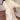 Luxury women's fleece robe in a soft cream color, featuring a cozy design with long sleeves and a tie-front for a comfortable fit.