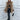 Luxury women's oversized faux fur winter coat in grey, featuring a high collar and elegant design. The coat has long sleeves and reaches knee length, providing warmth and style.