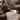 Luxury women's tan suede faux fur winter jacket with a soft texture, featuring a close-up view showcasing the intricate textile design and material properties.