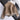 Luxury women's tan suede faux fur winter jacket featuring long sleeves, a plush collar, and button details, showcasing a fashionable beige pattern.