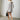 Luxury women's white and gray faux fur coat featuring a stylish winter fashion design with long sleeves, a high neck, and a fitted waist.