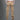Men's beige cargo pants featuring multiple pockets, displayed on a person, highlighting the pants' utility design and fit on the legs.