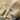 Men's beige lightweight wool crewneck sweater with long sleeves, showcasing fall fashion knitwear.