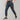 Men's black joggers with moisture-wicking fabric, featuring pockets, worn with sneakers. The pants are styled for athletic activities, showcasing the waist and legs, with a focus on comfort and functionality.
