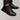 Men's black leather winter sneakers with fur lining, featuring a waterproof design, suitable for outdoor use.